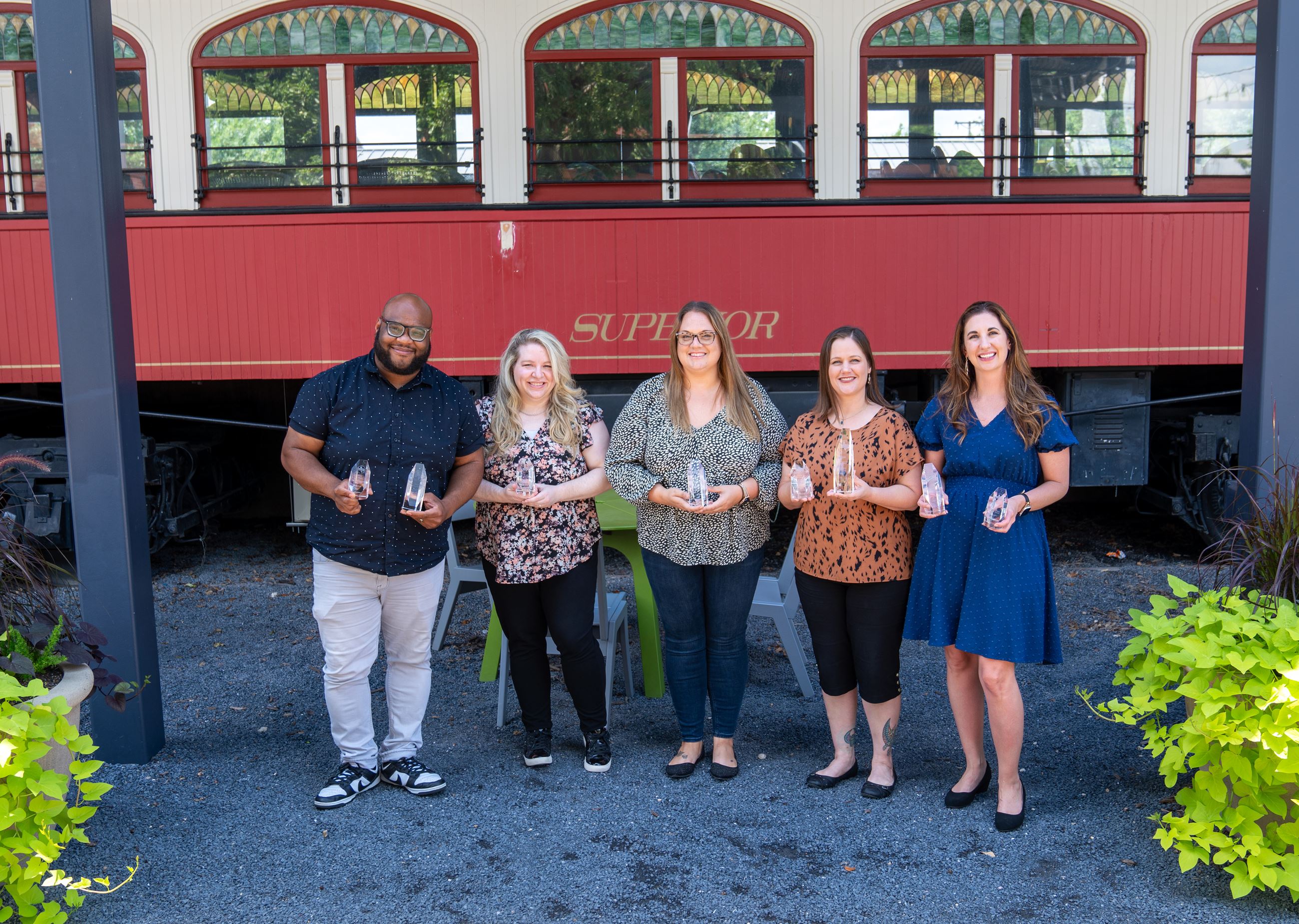 photo of the marketing and communications team with statewide awards in the Mayor Vera Calvin Plaza